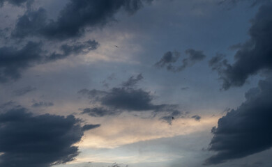 Beautiful bright sunset evening sky with dramatic clouds.