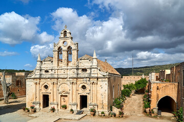 Facade and belfry of the historic church of the Orthodox monastery Moni Arcadia on the island of Crete