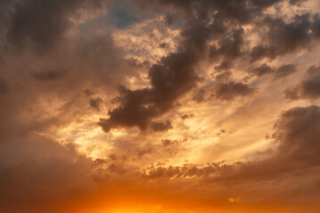 Beautiful bright sunset evening sky with dramatic clouds.