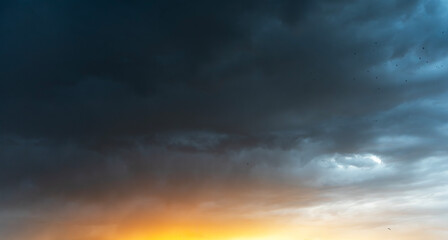 Beautiful bright sunset evening sky with dramatic clouds.