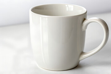 Plain white ceramic mug simple clean design for coffee or tea isolated on a light background 