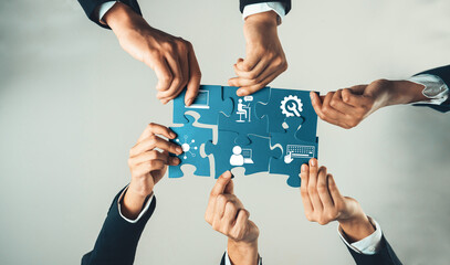 Top view panorama banner of business team assembling jigsaw puzzle over table symbolize business...