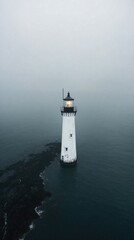 Distant White Lighthouse in Ocean Haze
