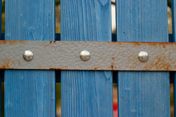 old wooden door with metal bolts and bracket