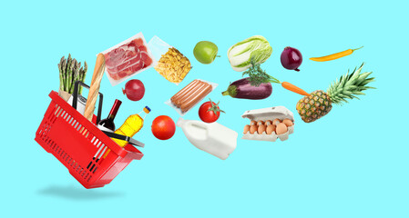 Food products flying into red shopping basket on light blue background