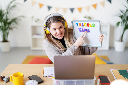 Teacher Tana is teaching online. She's using a whiteboard to help her students learn. Remote learning is important for continued education.