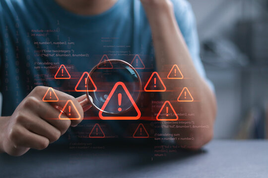 Cyber ​​attack and security alerts concept, Network failure dangers. Person using magnifying glass focus to error 404 alerts on virtual screen. Caution of spam in website digital technology.