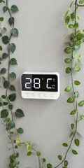 Digital thermostat temperature control smart home automation device with plants indoor home decor