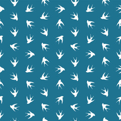 Seamless pattern with swallow silhouette on color background. Cute bird in flight. Vector illustration. Doodle style. Design for invitation, poster, card, fabric, textile.