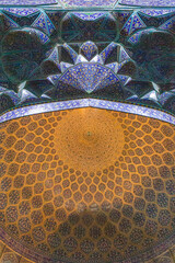 Exquisite ceiling of the Sheikh Lotfollah Mosque in Esfahan, Iran, featuring mesmerizing geometric patterns and symmetrical Persian artistry.