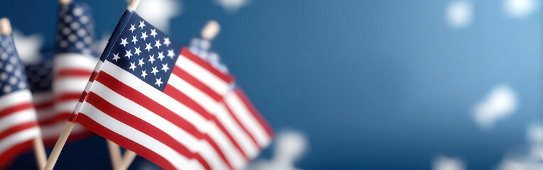 Celebrating Independence Day with American flags against a blue background for a joyful 4th of July occasion. concept of independence day of america