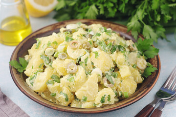 A bowl with Greek potato salads	