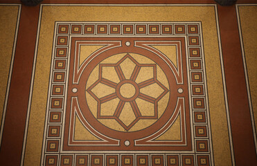 Mosaic floor with multicolored small square tiles with an abstract pattern