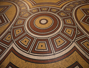 Mosaic floor with multicolored small square tiles with an abstract pattern