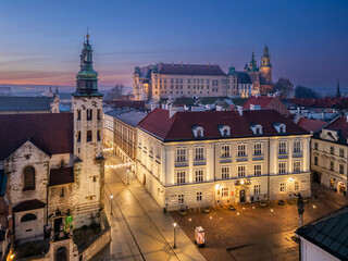 Obraz premium St Andrew church towers and Wawel castle over Krakow old city during blue hour, Krakow, Poland