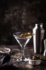 Traditional martini cocktail with olives and