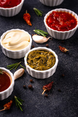 Set of different sauces. Ketchup, mustard, pesto