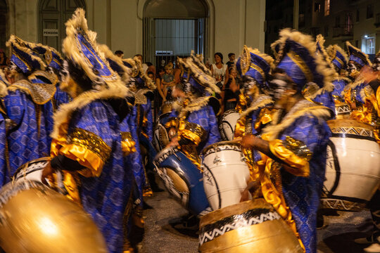 Drummers and dancers from 'comparsas' groups celebrating the traditional 'llamadas' parade during the carnival in Montevideo, Uruguay