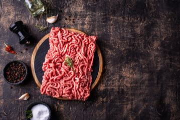 Raw minced meat on dark background