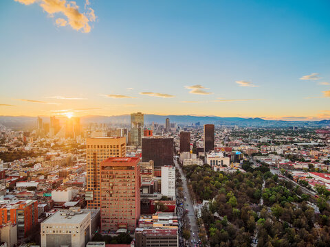 View over Alameda Central towards High-rise buildings of Paseo de la Reforma at sunset, Mexico City, Mexico