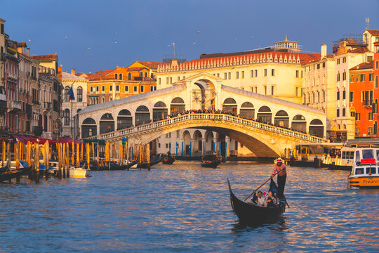 Sunset over Rialto Bridge in Venice, Venezia province in Veneto district, Italy - Powered by Adobe