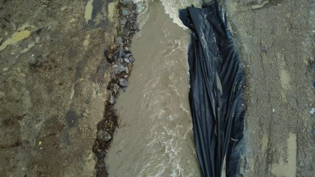 The place where the Corund stream floods the salt mine in Praid - Romania, as a result of soil erosion