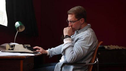 Soft-focused image of a writer struggling with creativity at his cluttered desk, surrounded by...
