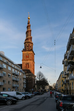 Architectural detail of Vor Frelsers Kirke, a baroque-style church known for its corkscrew-shaped spire, offering panoramic views of the city from the top of its tower.