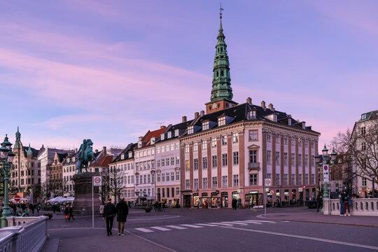 View of Hv?jbro Plads, a historic square near the canal, known for its equestrian statue of Bishop Absalon and its vibrant role in the city's cultural and commercial life.