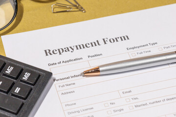 Business Desk with Repayment Form &ndash; Symbol of Debt Handling and Fiscal Responsibility

