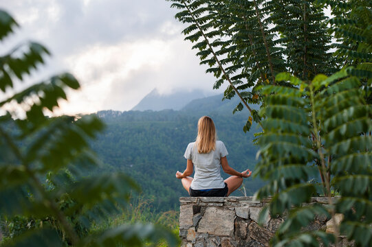 Young woman practising yoga posture at Santani Wellness Resort, Arantenna Estate, Werapitiya, Kandy, Sri Lanka, Indian subcontinent, South Asia