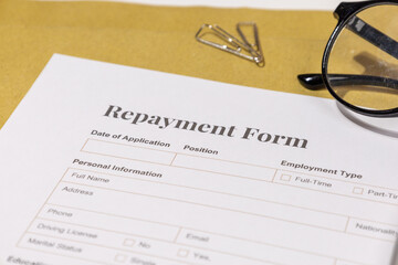 Repayment Form Paper on Desk – Business Concept of Loan Management and Financial Planning

