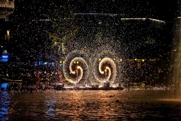 Molten iron being spun to form spectacular sparks. WuNvZhou Resort, Wuyuan County, Shangrao, Jiangxi Province, China
