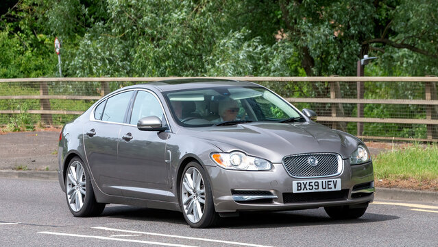 Milton Keynes,Bucks,UK - May 29th 2025:  2009 grey Jaguar XF V6  car driving on a British road.
