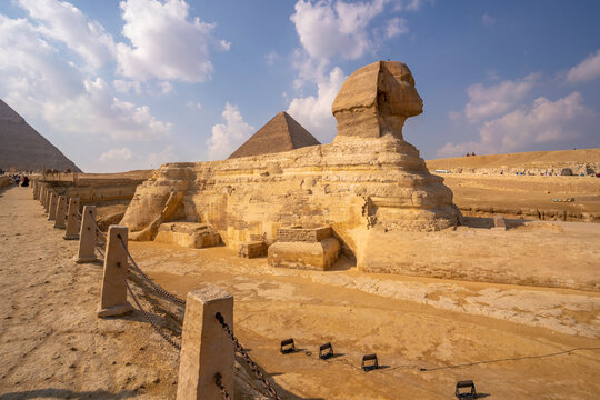 View of the Sphinx at the Pyramids of Giza on a sunny day, Giza, Cairo, Egypt, Africa