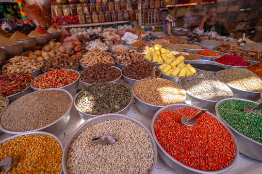 View of colourful spices on market stalls at Nagaa Suhayl Gharb on the Nile river near Aswan, Aswan, Nubia, Egypt, North Africa, Africa