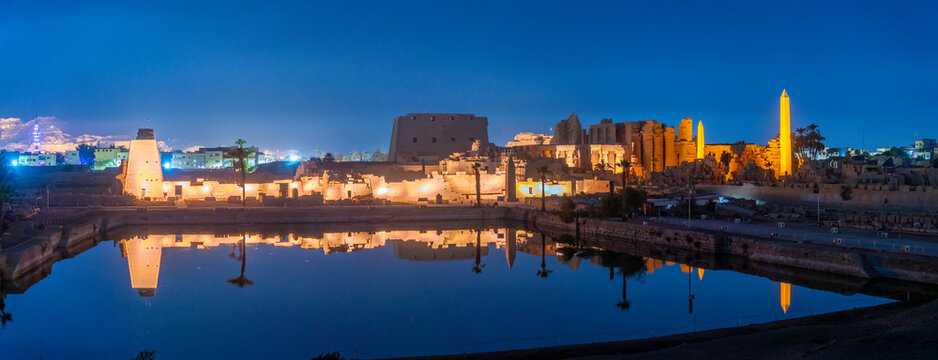 View of Karnak Temple sound and light show at dusk, Luxor, Egypt, Africa