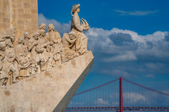 View of Monument to the Discoveries (Padrao dos Descobrimentos) and 25 April Bridge on a sunny day, Lisbon, Portugal, Europe