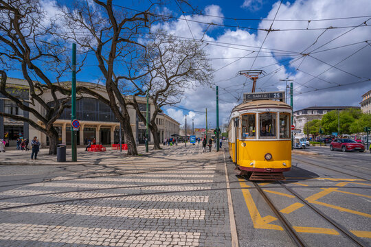 View of vintage yellow tram in PC Duque da Terceira on a sunny day, Lisbon, Portugal, Europe