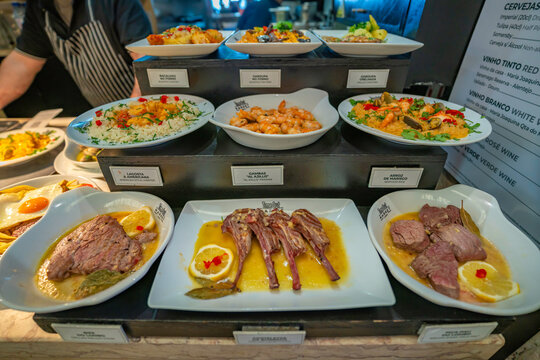 View of food on display in the food court in the interior of Time Out Market, Lisbon, Portugal, Europe
