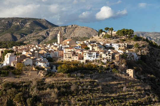 View of town in the mountains with church and castle, Polop, Alicante Province, Valencia, Spain, Europe