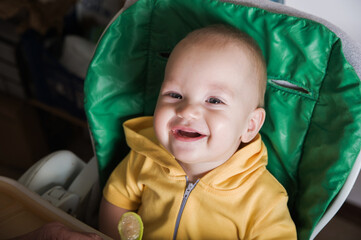 Happy Baby Being Fed by Grandmother at Home