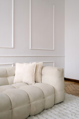 Comfortable white modern couch in stylish, minimalist interior design space