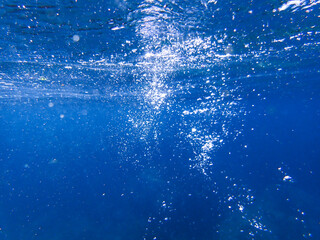 Bubbles underwater rising to water surface, natural scene bubble under water, Mediterranean sea