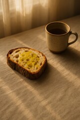 Rustic breakfast elegance: simple composition of bread and coffee in warm light