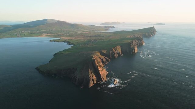 Picturesque 4K Aerial video of flying above scenic Dingle Peninsula Atlantic coast at sunset, Kerry, Ireland