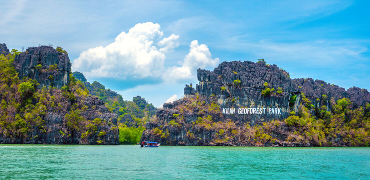 Boat ride along the karst rock formations of the Kilim Langkawi UNESCO Geoforest Park, Langkawi, Kedah, Malaysia