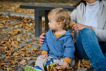 Child and parent enjoying a serene autumn day outdoors