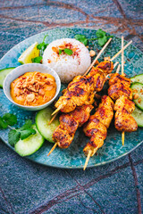 Sate Ayam - grilled chicken satay sate skewers with peanut dipping spicy sauce, steamed rice and...