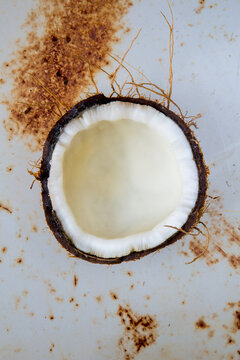 Half of a coconut on metal surface 